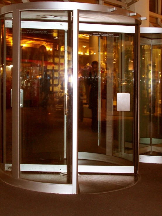 two people entering an elevator, in a building