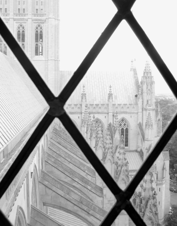 a window view of a cathedral looking over a building