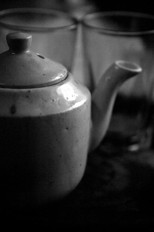 tea pots sitting next to each other with one open