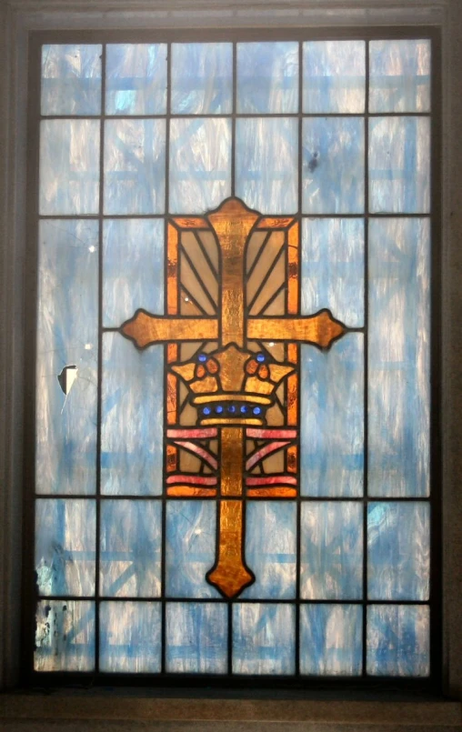 an image of a stained glass window with the cross on it