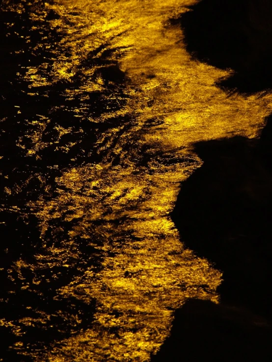 light reflecting on dark water at night