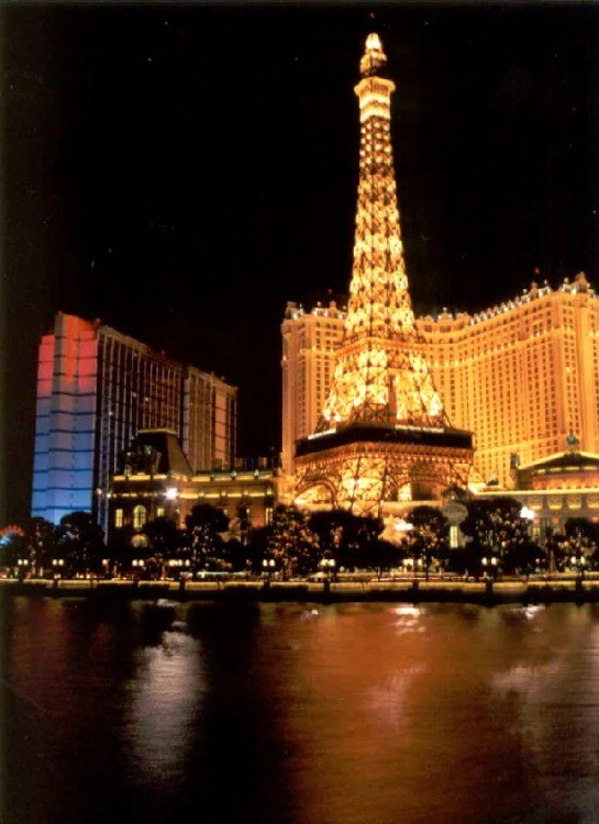 a night view of the eiffel tower, vegas, las vegas and other buildings