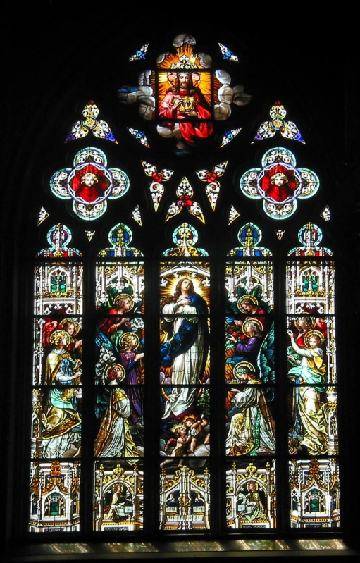 a large stained glass window inside of a church