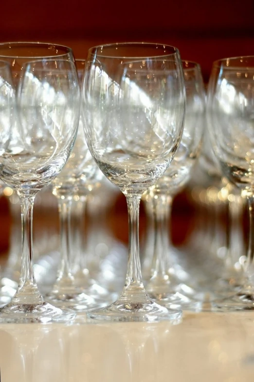 a close up of many empty wine glasses