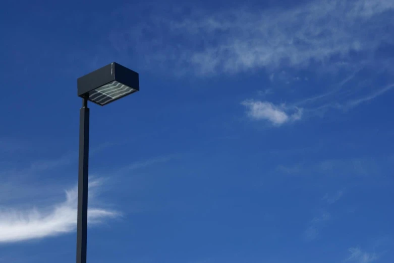 the side of a street lamp near an empty street