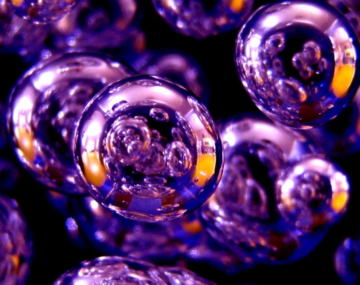 a large pile of bubble shaped glass balls