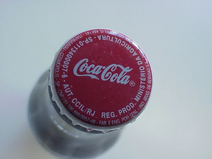 a small bottle filled with some coke