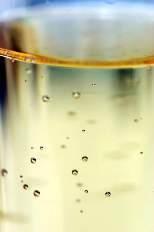 a liquid filled glass with water bubbles