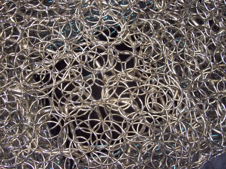 a closeup s of a silver metal mesh