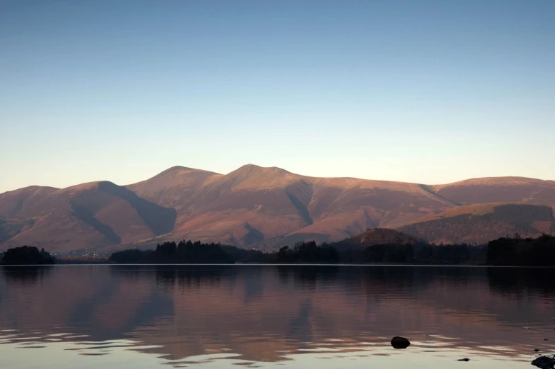 a beautiful mountain scene with lots of water and a lake