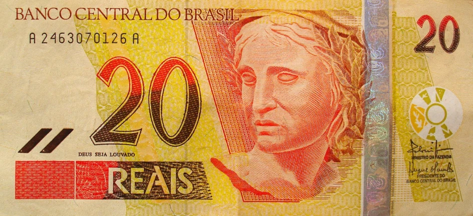 an open bank note with an image of a man