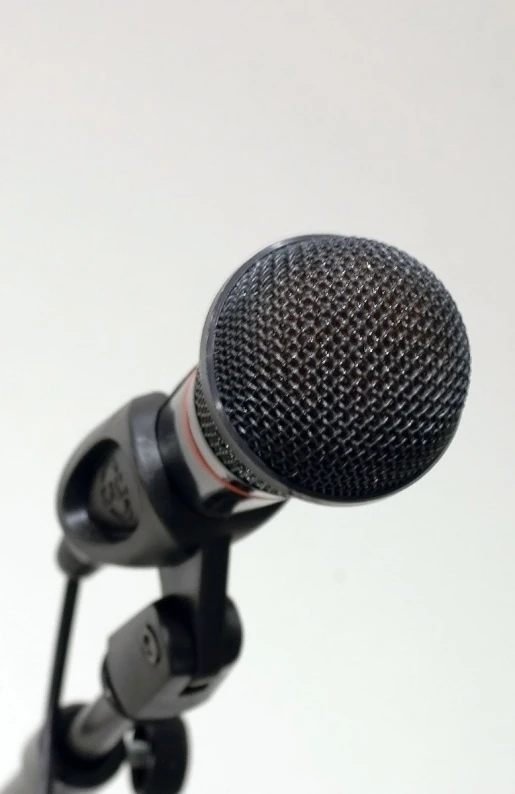a microphone sits on a stand in a room