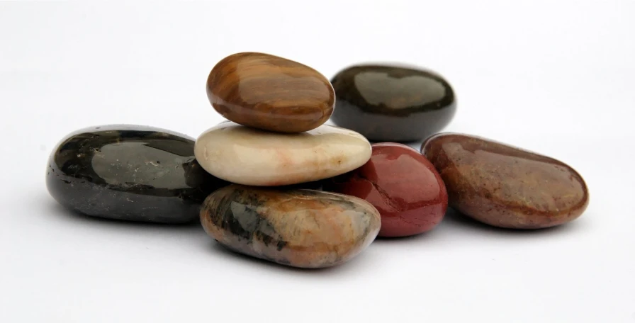 the stones are lined up together and there is a white background