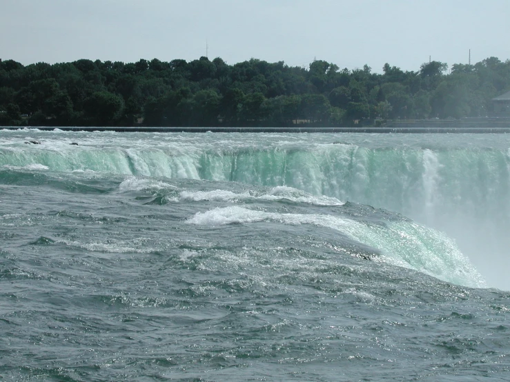 a view of the water on the side of a large waterfall