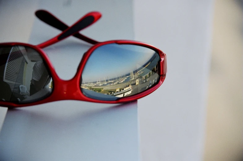 a pair of red sunglasses is shown on the wall