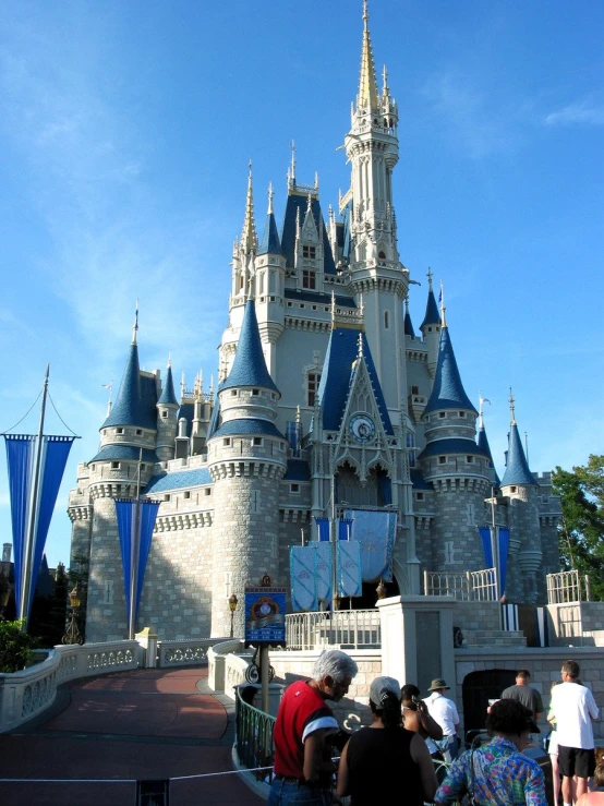 people at the entrance of the sleeping beauty castle