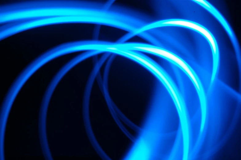 an abstract background consisting of several bright blue light images