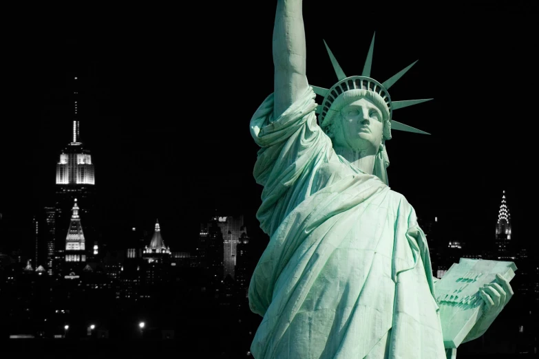 the statue of liberty, looking toward empire island and new york city