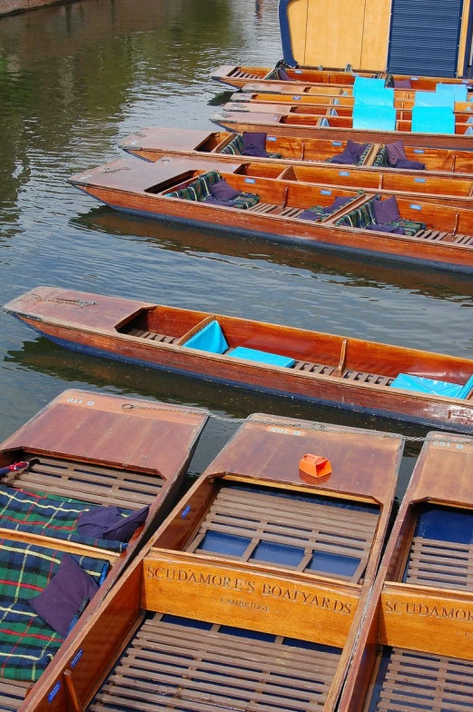 several wooden boats docked in the water