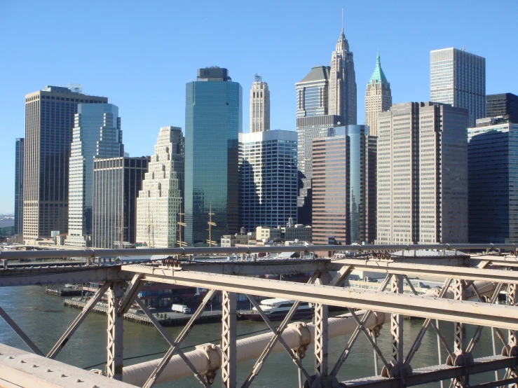 a city with a train coming across the bridge