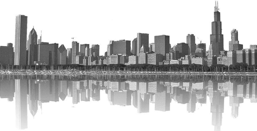 city buildings reflected in the water on a lake