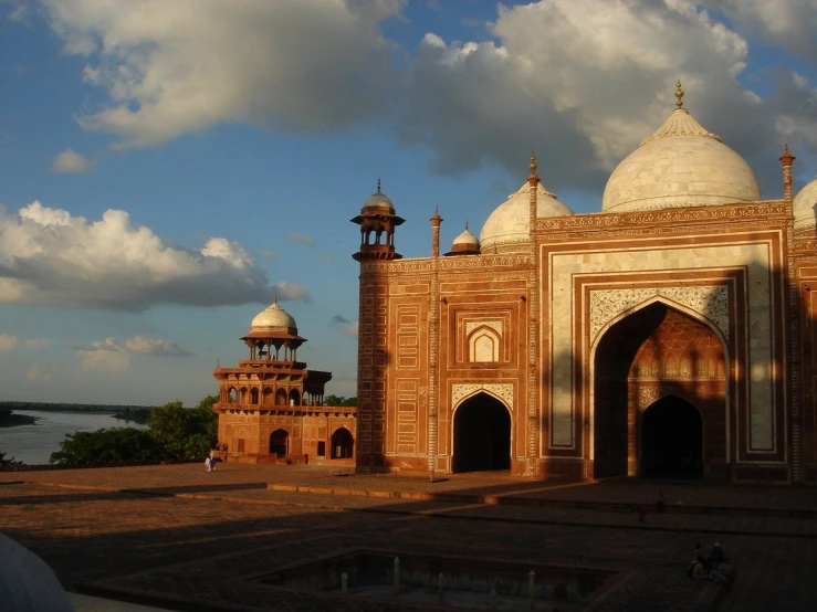 a large building with arches and pillars on top