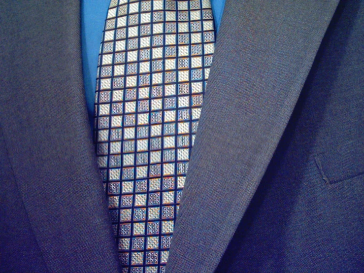 a neck tie is shown with a purple jacket and blue shirt