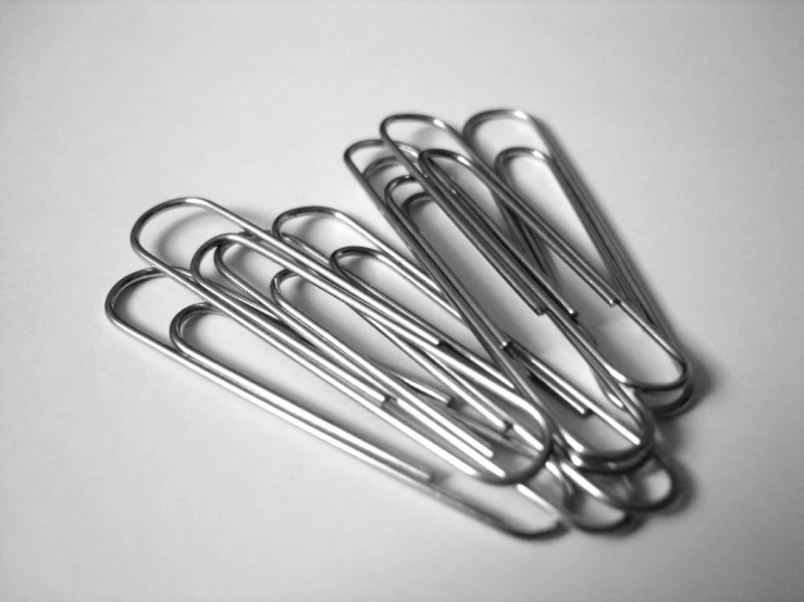 several different set of metal scissors stacked together