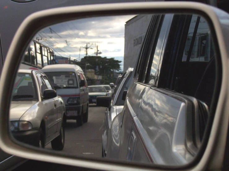 a view of the traffic in a car's side mirror