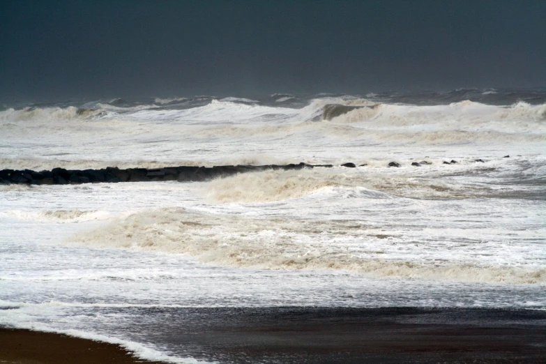 the ocean waves are coming in onto the beach