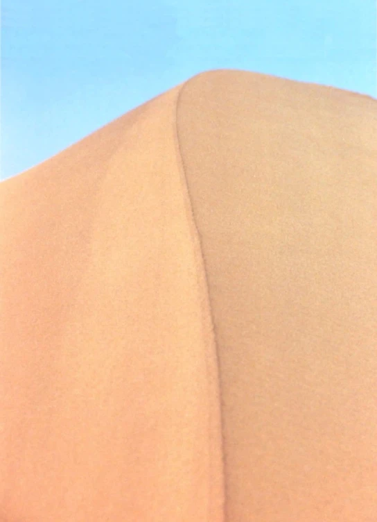 some brown dunes with blue sky and white clouds