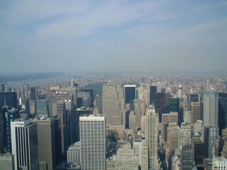 an aerial view of many tall buildings in a city