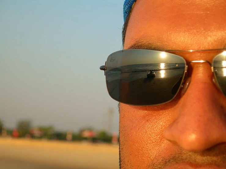 a close up view of a man with sunglasses