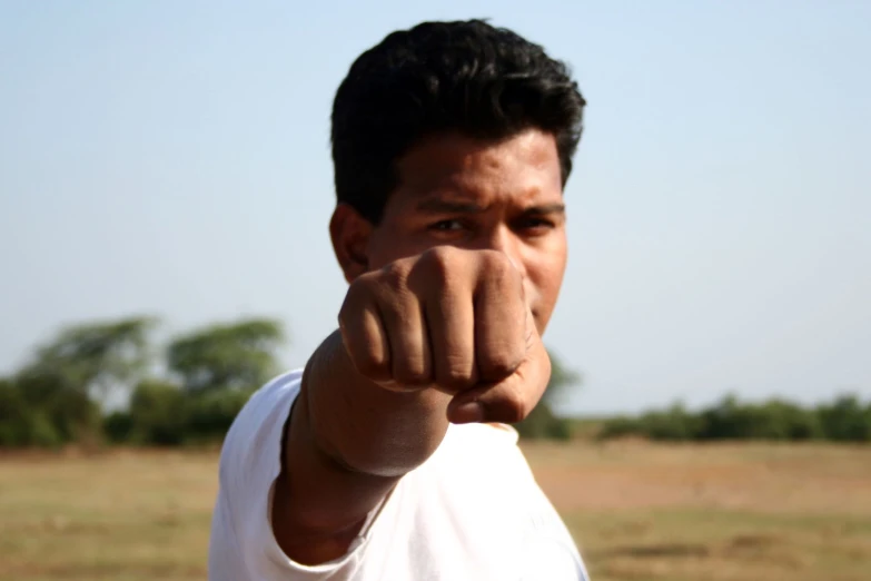 an image of a man pointing to the camera