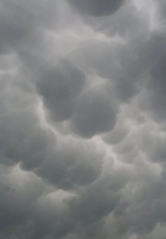 a dark and stormy sky with some clouds