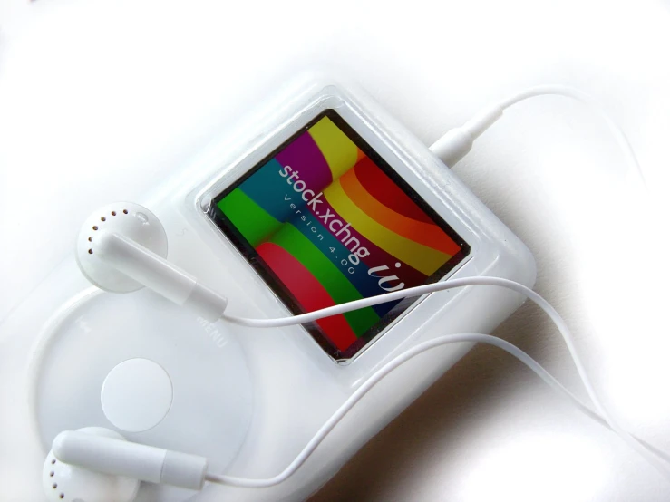 a mp3 player with a colorful label hooked up to it