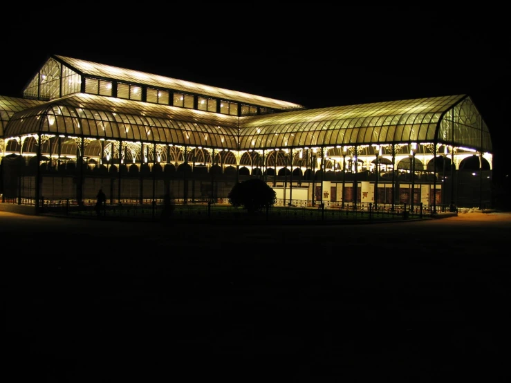 a lighted up building at night with no lights on