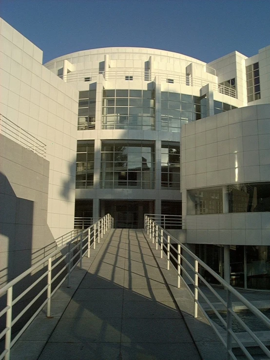 the building is white with a circular entrance
