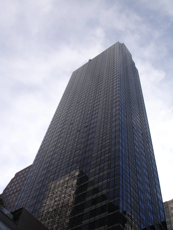 the top of the skyscr with some tall buildings around it