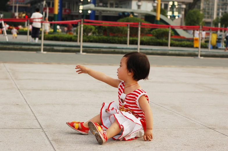 a young child playing with a kite in the park