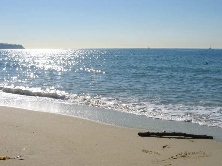 a po of the beach and ocean as seen from the sand