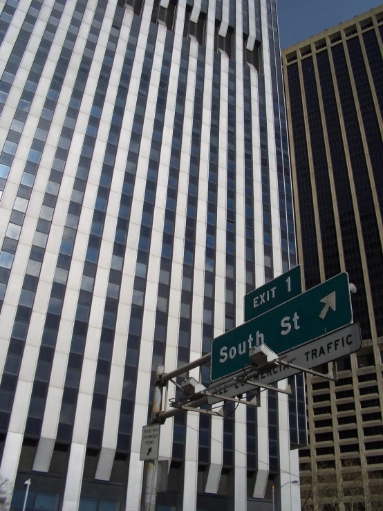 a street sign in front of an office building