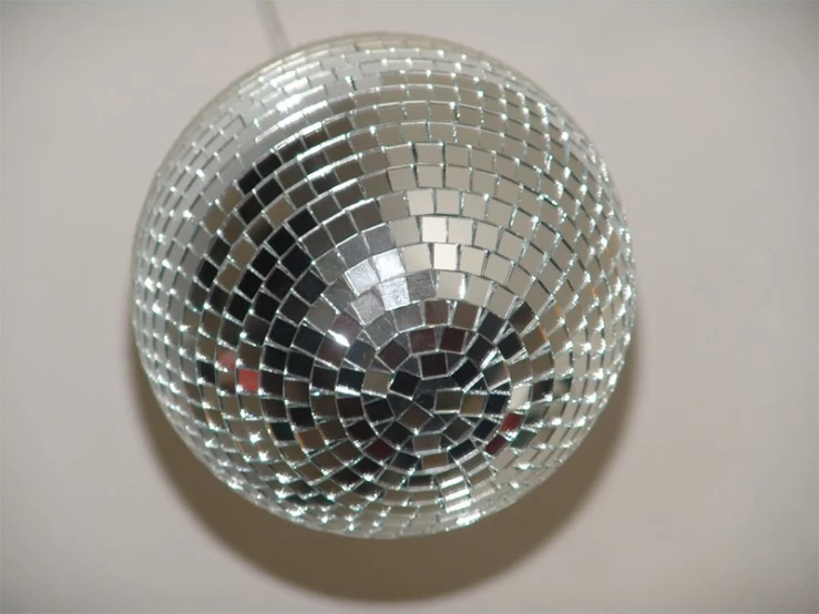 the mirror ball is laying against the wall