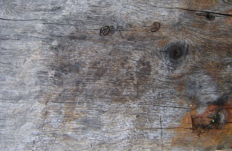 the wood is old and has been stained with varnish