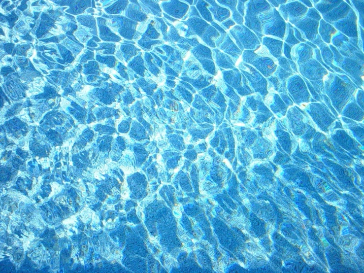 a view from under a blue swimming pool