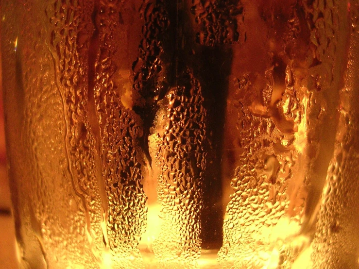 the inside of a beer can with yellow bubbles