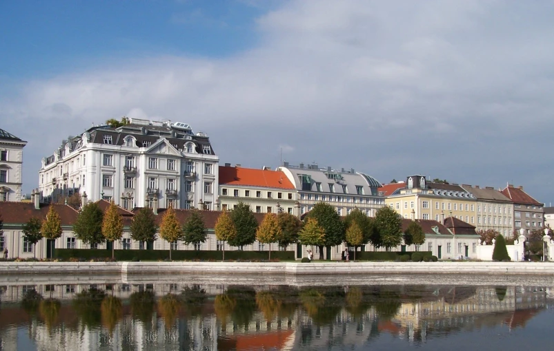 a few buildings sitting next to a river