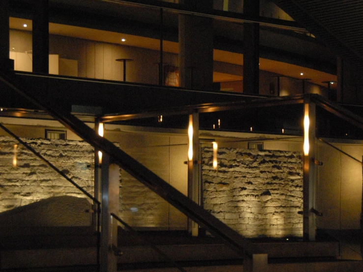 an indoor stairwell lit up with yellow lights