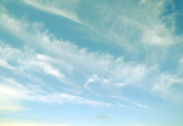 a large kite flying high up in the sky