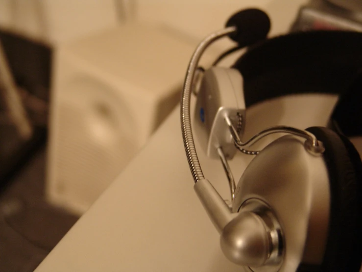 a black and silver headphone on top of a sink